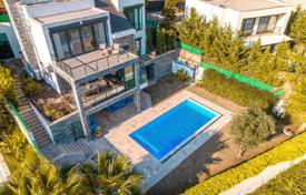 Villa in Yalikavak, 150 m from the sea, 4 km from marina, with swimming pool and a bar, gym, solar panels, parking, video surveillance for $1,295,000