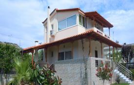 Villa with a garden and a parking at 150 meters from the sea, Loutraki, Greece. Price on request