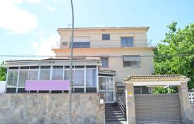 Three-storey house with a balcony and a terrace, in a quiet area, 100 meters from the beach, Castelldefels, Spain. Price on request