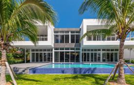 Modern seaside villa with a garden, a swimming pool, a garage, a terrace and views of the bay, Golden Beach, USA for $13,995,000