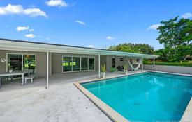 Comfortable villa with a backyard, a swimming pool, a sitting area and a garage, Miami, USA for $1,075,000