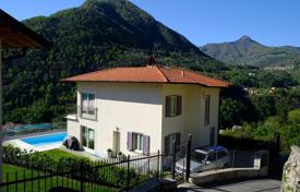 Three-storey villa with two pools and a garden on Lake Como in Argegno, Italy for 1,400,000 €