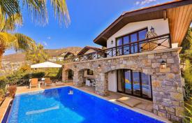 Cozy villa with a swimming pool and a pier in a quiet area, 100 meters from the sea, Kalkan, Turkey for $8,500 per week