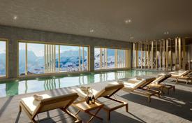 Duplex apartment with a view of the mountains in a new residence with a pool, a fitness center and a spa, on the ski slope, Huez, France for 1,535,000 €